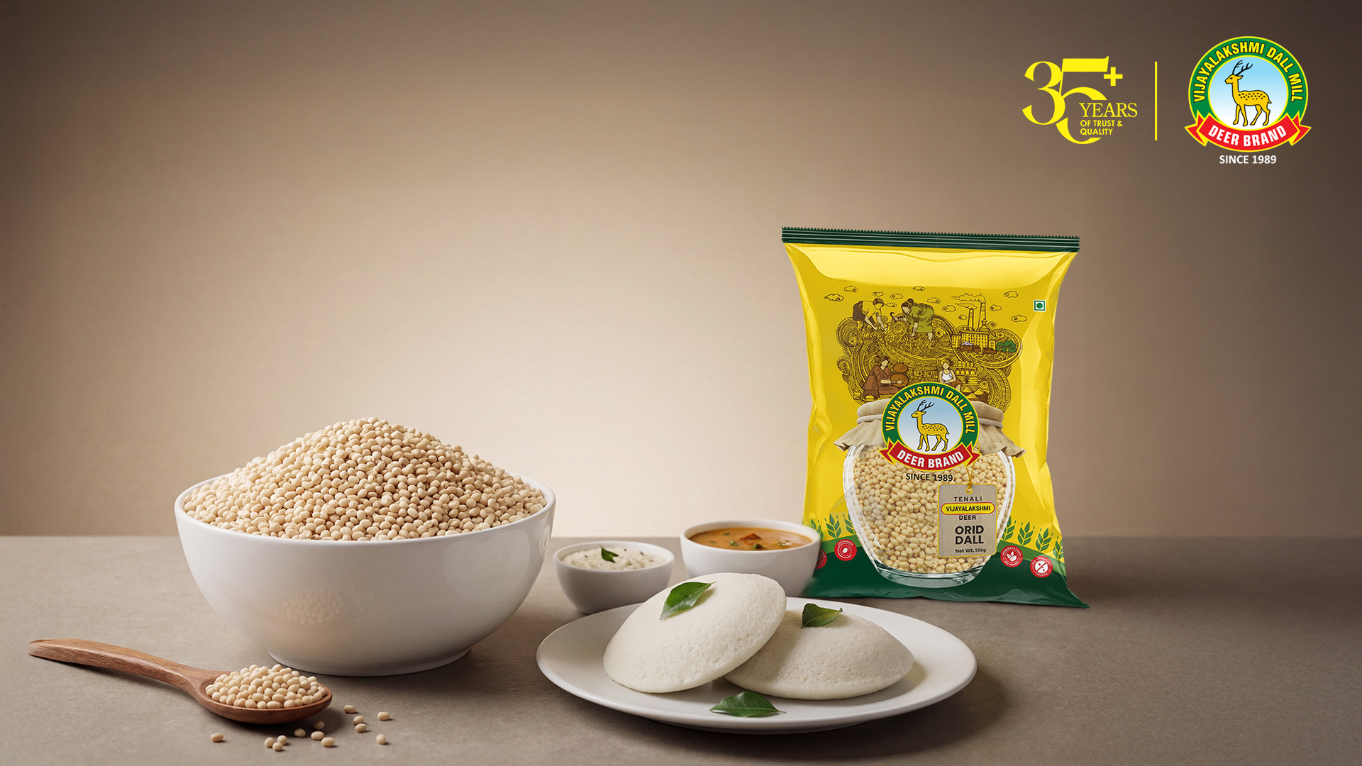 Vijaya Lakshmi Deer Brand urad dal pack with whole dal in a bowl and soft idlis served with chutney and sambar – premium quality dal for traditional South Indian cooking.